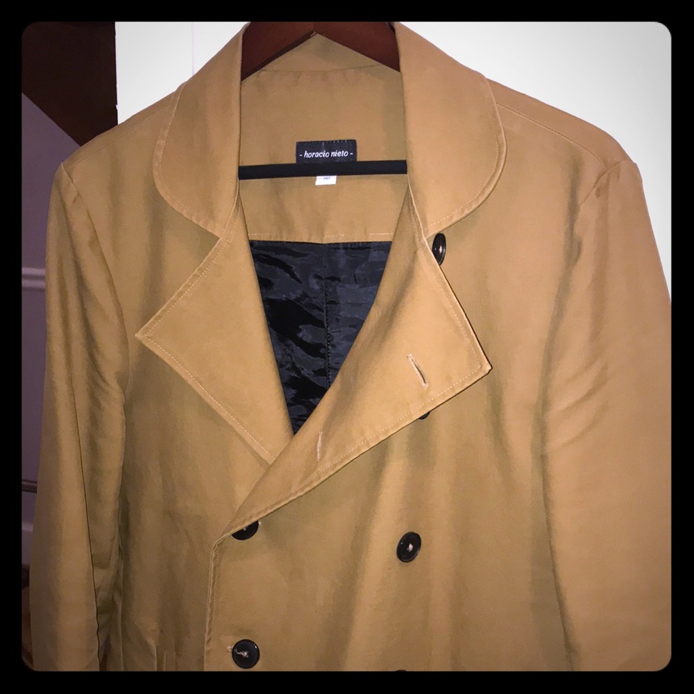 Double-Breasted Rain Jacket By Horacio Nieto.